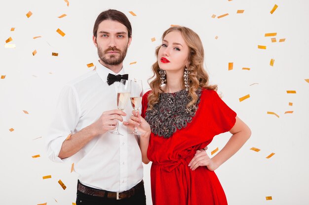 Young stylish couple in love celebrating new year and drinking champagne