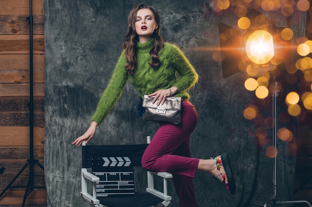 Young stylish sexy woman on cinema backstage