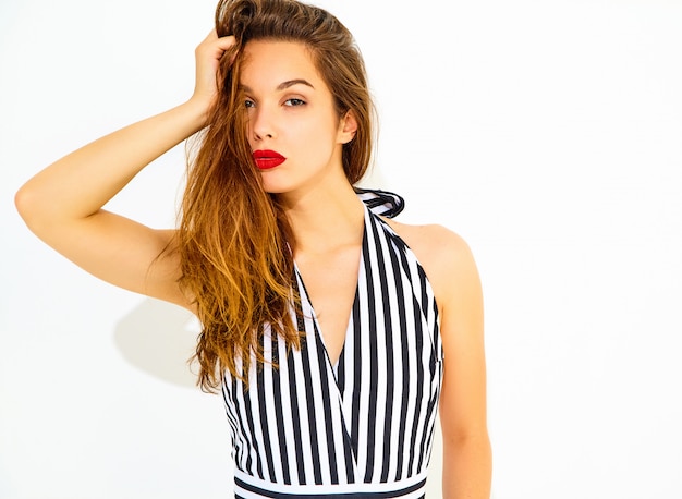 Young stylish woman model in casual summer striped suit with red lips, isolated