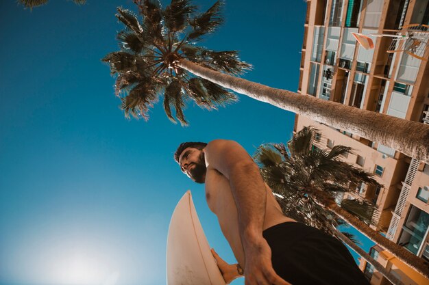 Young surfer on resort