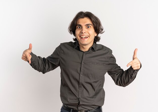 Young surprised handsome caucasian man points down with fingers isolated on white background with copy space