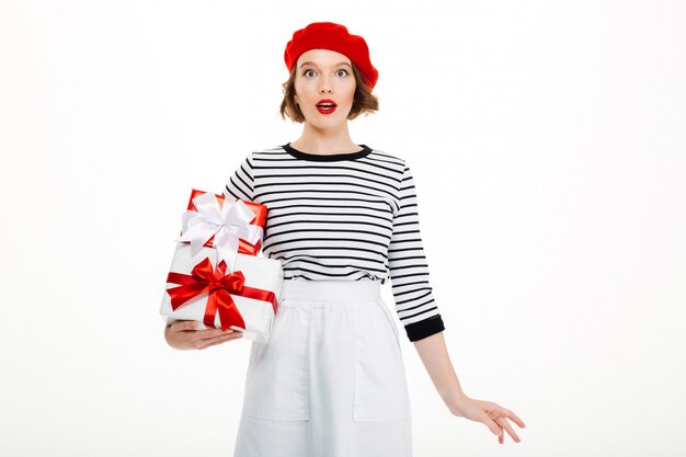 Young surprised lady holding gift surprise box.