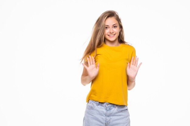 Young surprised woman isolated on white wall