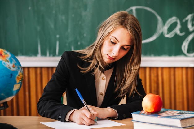 young teacher working in class