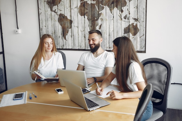 Young team working together and use the laptop