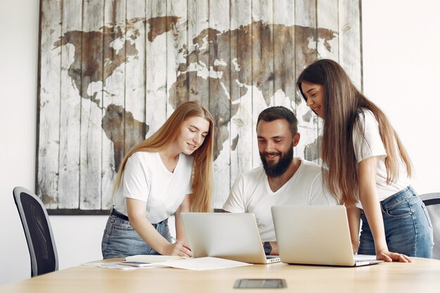 Young team working together and use the laptop