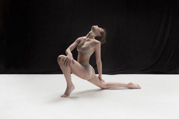 Young teen dancer on white floor