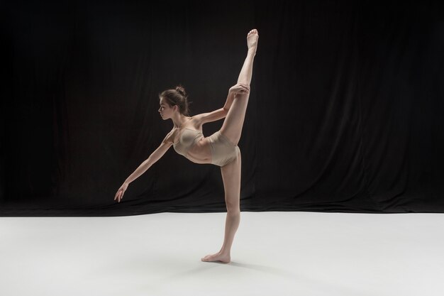 Young teen dancer on white floor