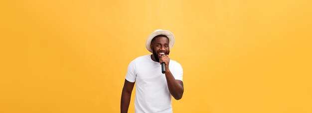 Young teenage black african american boy singer performing at a concert