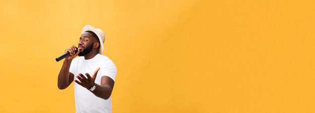 Young teenage black african american boy singer performing at a concert