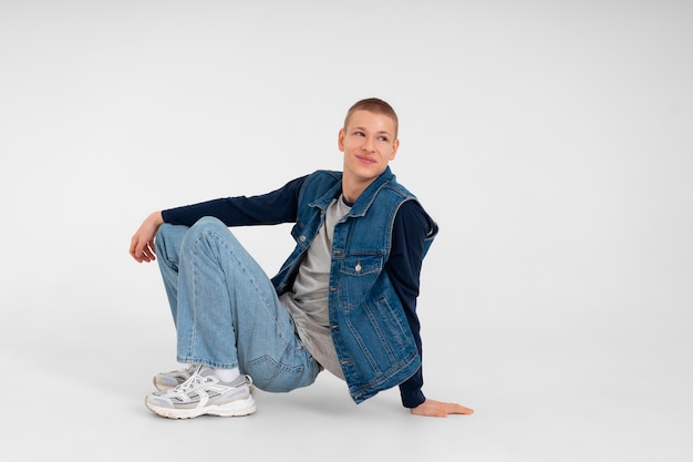 Young teenage boy wearing a denim outfit