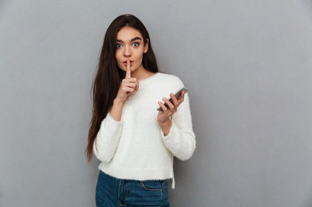 Young teenager woman with smartphone