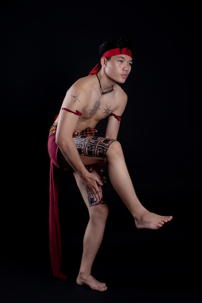 young Thailand man doing a traditional dance