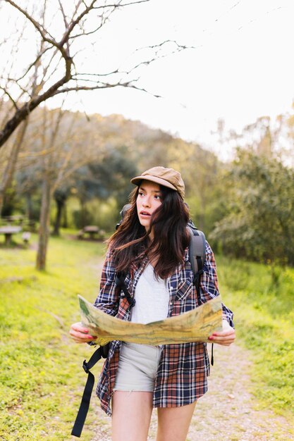 Young tourist searching right direction