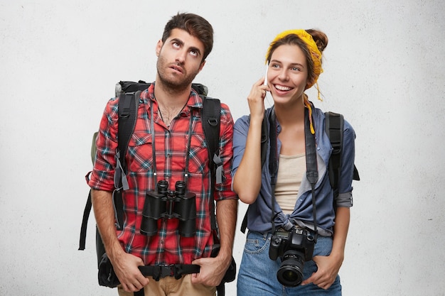 Free photo young tourists couple with equipment