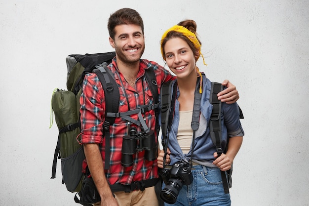 Young tourists couple with equipment