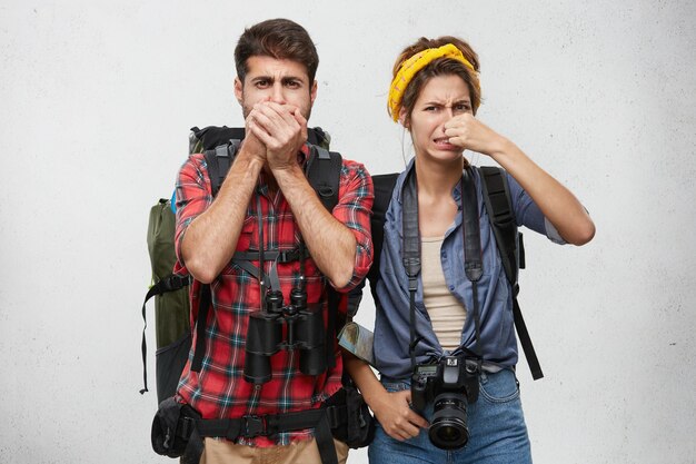 Young tourists couple with equipment