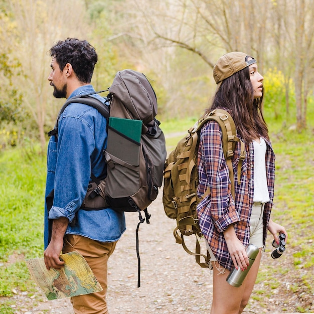 Free photo young tourists in forest