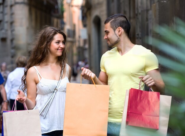 Young tourists in shopping tour