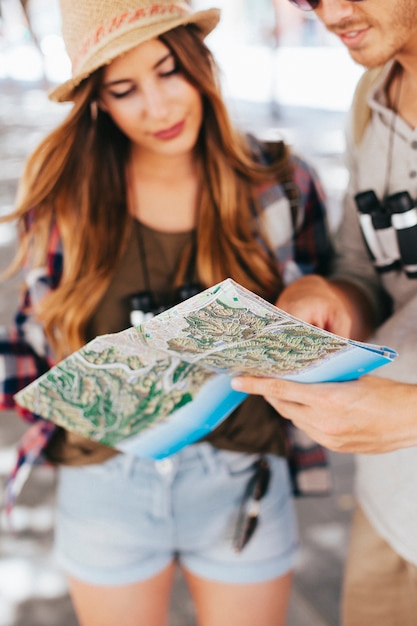 Young tourists with map