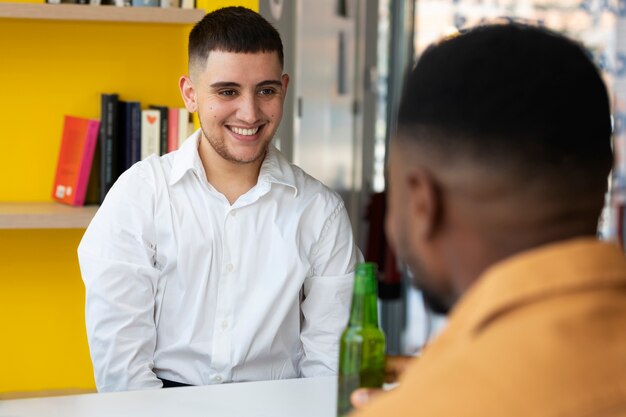 Young trans man working as a waiter