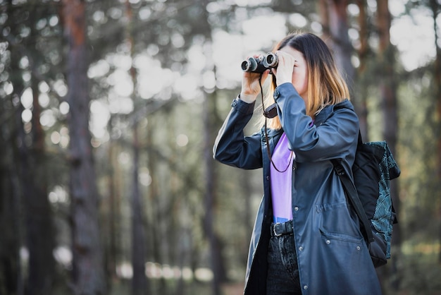 Young traveleer with binoculars