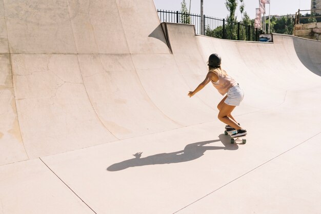 Young urban girl skating