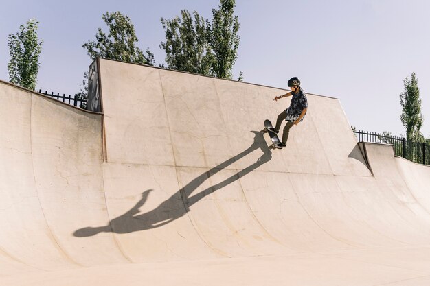 Young urban girl with helmet skating