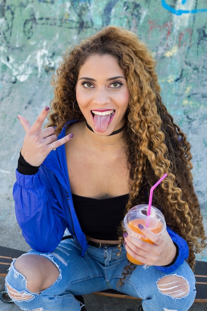 Young urban woman with smoothie