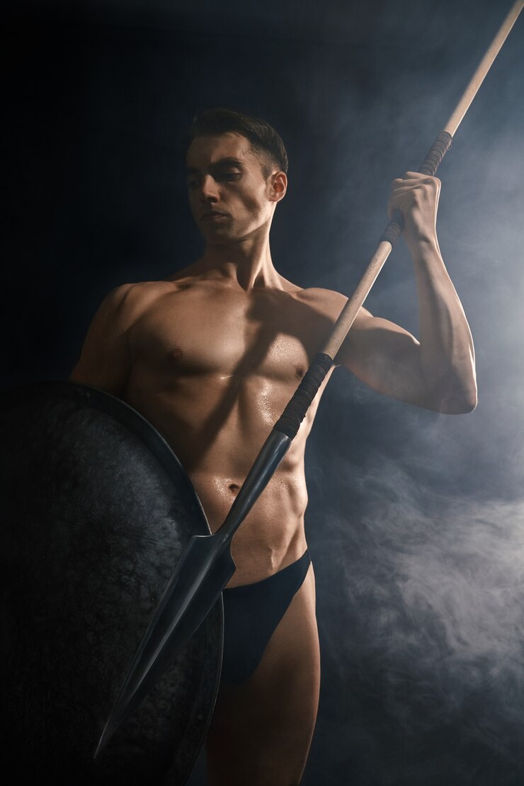 Free Photo young warrior throwing spear