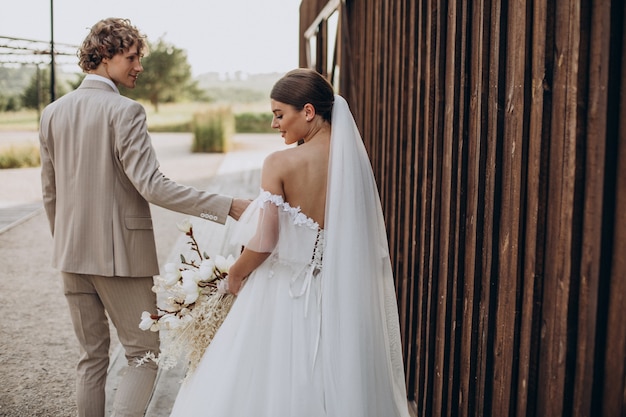 Free photo young wedding couple on their wedding