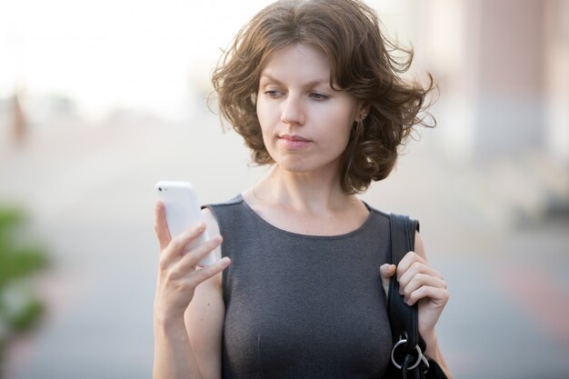 Young woman answering phone call