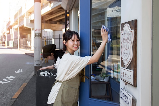 Young woman arranging her cake shop