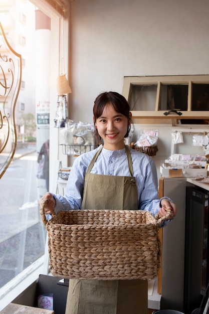 Young woman arranging her cake shop