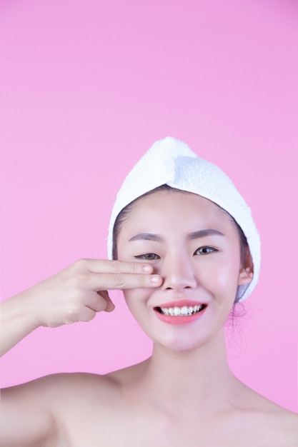 Free photo young woman asia with clean fresh skin touch own face, expressive facial expressions, cosmetology and spa.