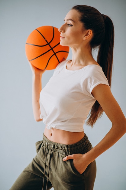 Free photo young woman basketball player isolated