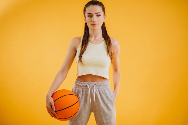 Young woman basketball player isolated 