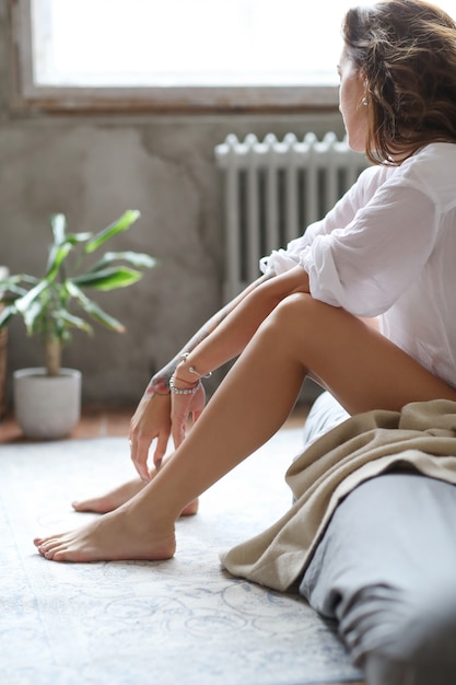 Young woman in bed at morning