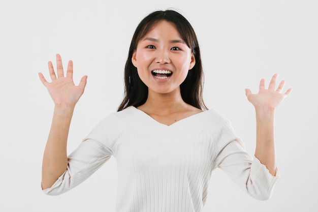 Young woman being shocked with white background