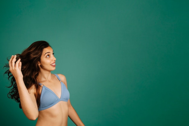 Young woman in bikini side view