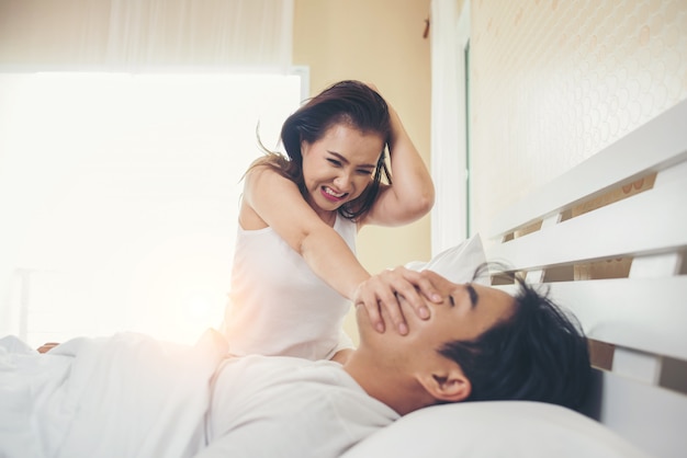 Young woman bored with her boyfriend snoring