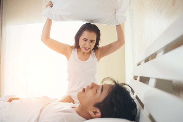 Young woman bored with her boyfriend snoring