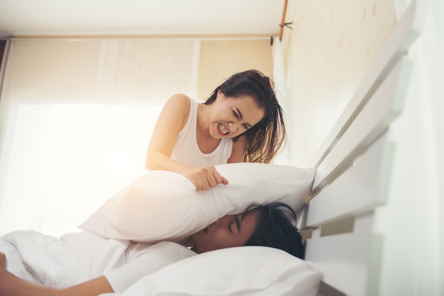 Young woman bored with her boyfriend snoring