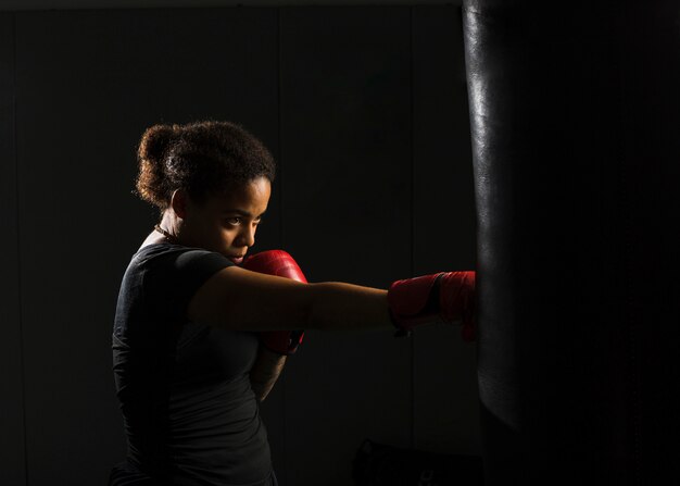Young woman boxing in the gym