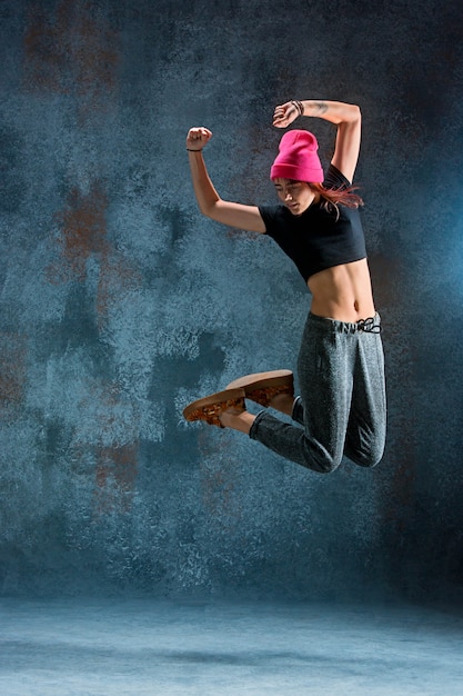 Young woman break dancing.