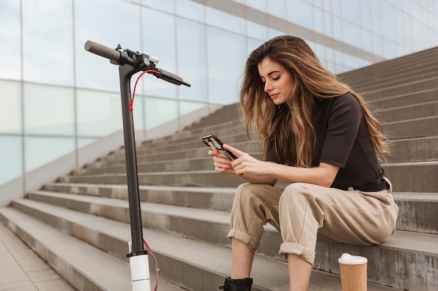 Young woman browsing her mobile phone