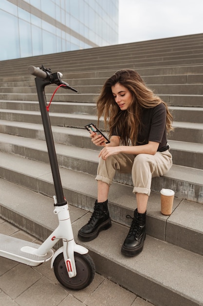 Young woman browsing her mobile phone