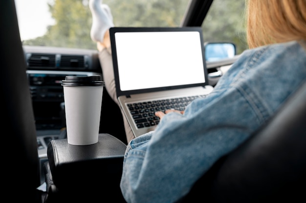 Free photo young woman browsing laptop