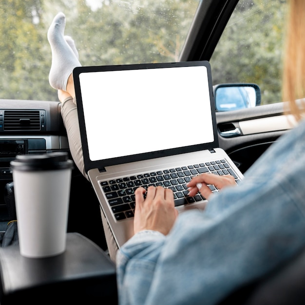 Free photo young woman browsing laptop