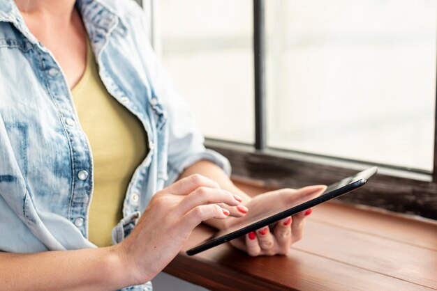 Young woman browsing on a tablet